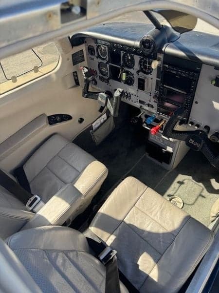 Overview of the aircraft's interior, showing the seats, instrument panel, and cockpit.