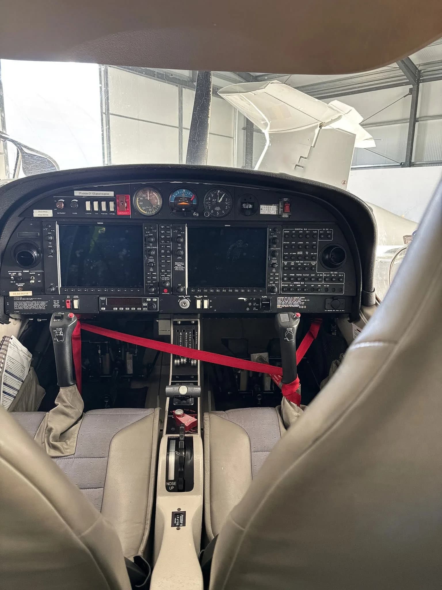 View of the instrument panel and controls of a Diamond DA40 aircraft.