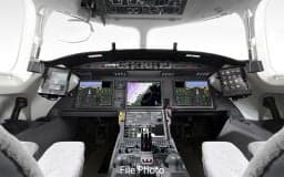 The cockpit of a Falcon jet with advanced avionics.