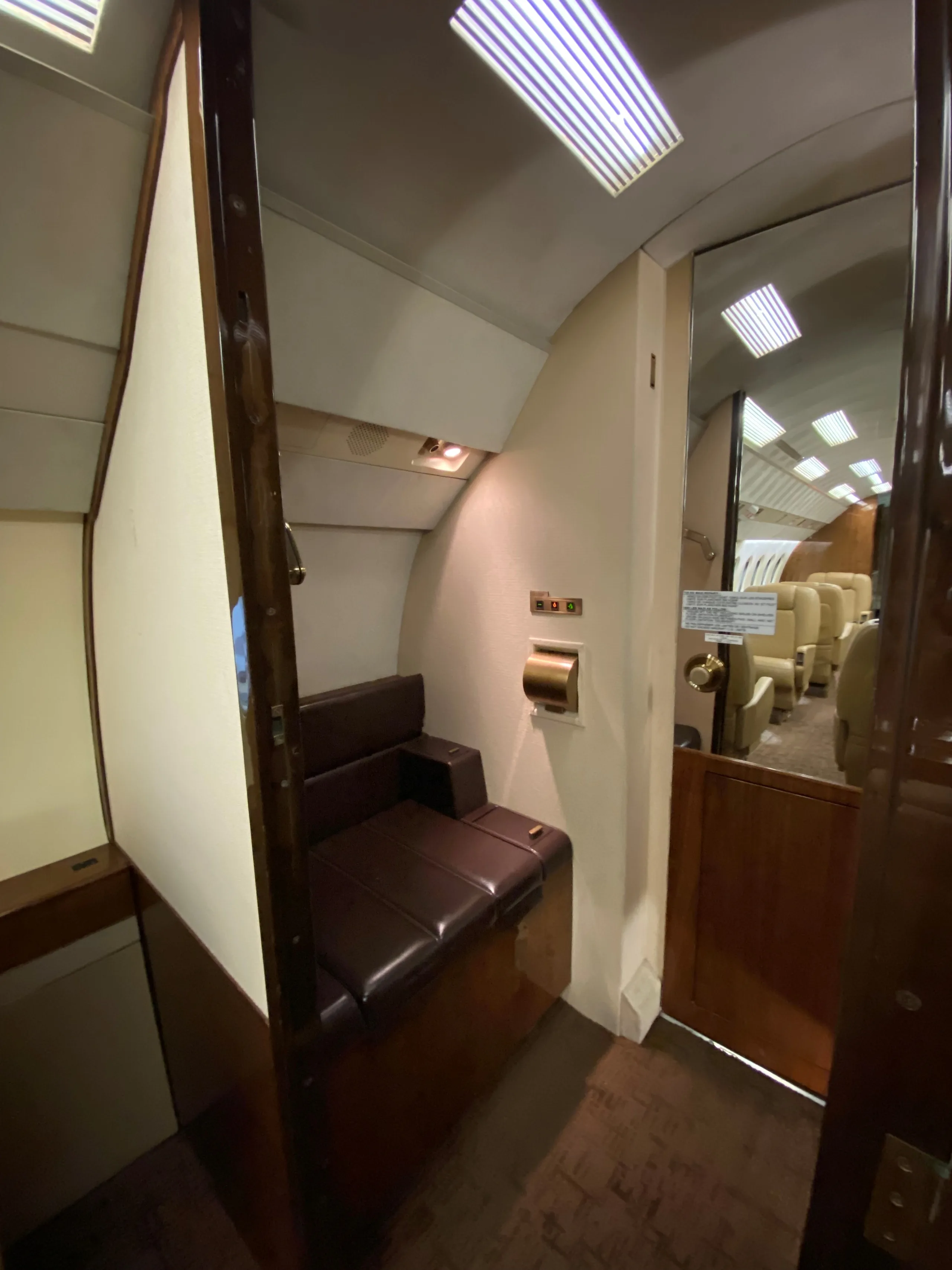 View of the aircraft's lavatory and cabin seats.