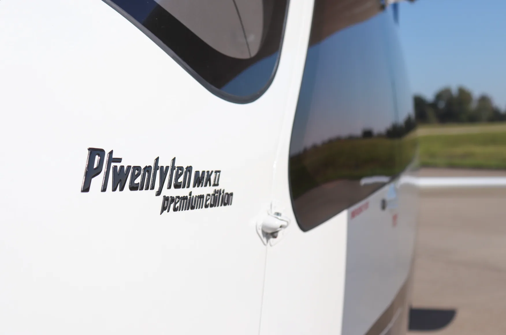 A close-up of the 'Ptwentyten MKII premium edition' text on the white fuselage of the aircraft.