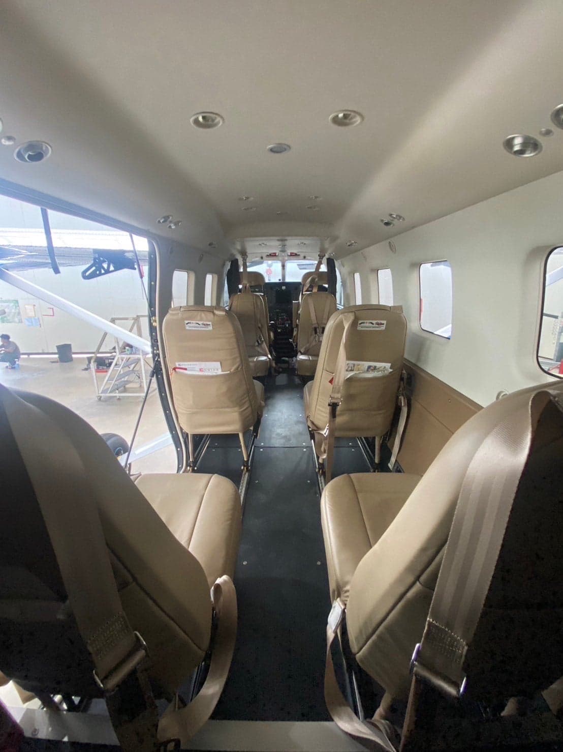 Interior view of the Kodiak 100 cabin with tan leather seats.