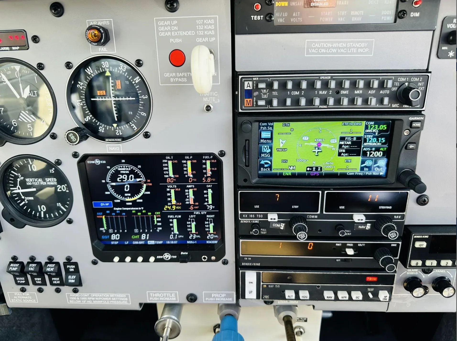 A close-up view of the right side of a Mooney aircraft's instrument panel, featuring various avionics and displays.