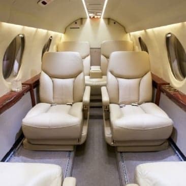 Hawker 400XP aircraft N365DE parked inside a hangar.