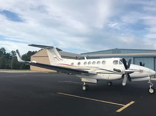 Side view of a King Air on the tarmac.