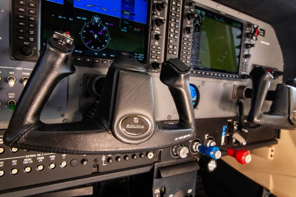 Close-up of the control yoke and instrument panel of a Cessna Skylane.
