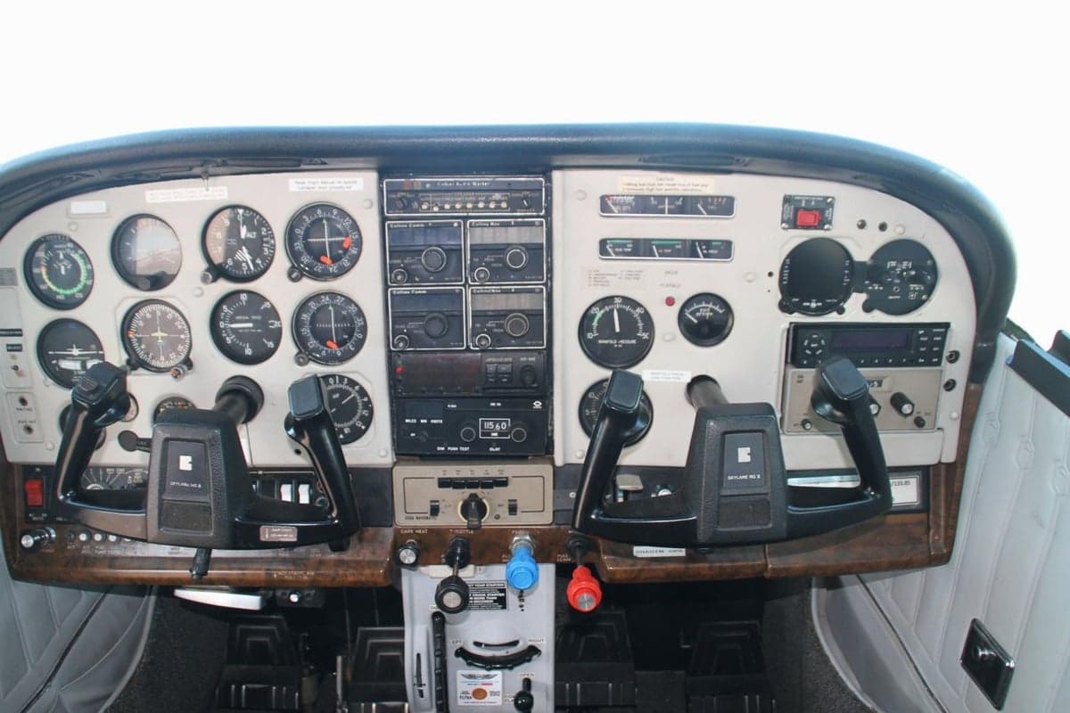 The cockpit of the aircraft features a full instrument panel and control yokes.