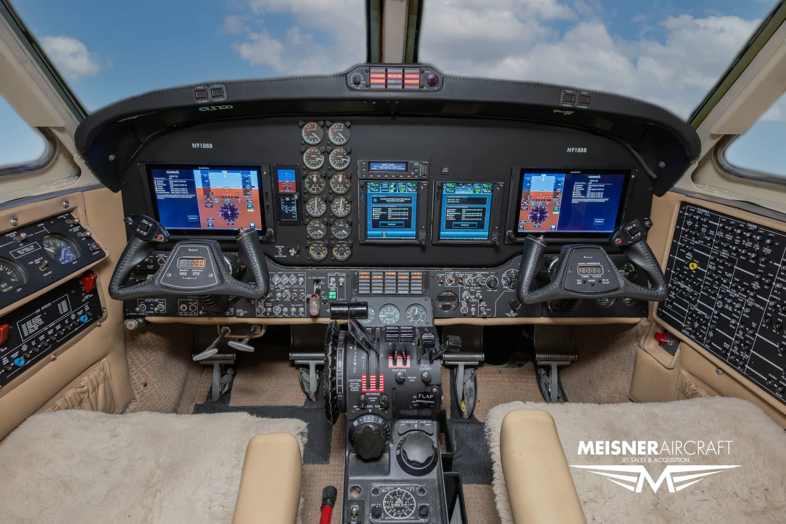 The cockpit of a Beechcraft King Air N918BB with modern avionics displays.