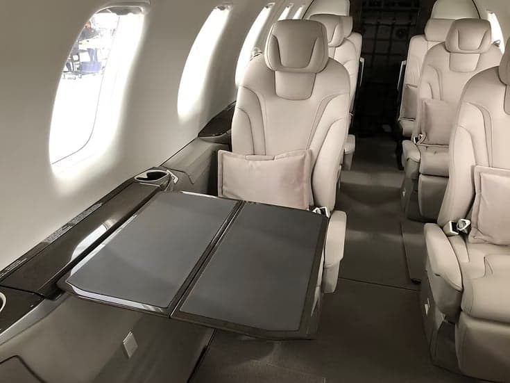 A view of the aircraft cabin seating and fold-out table.
