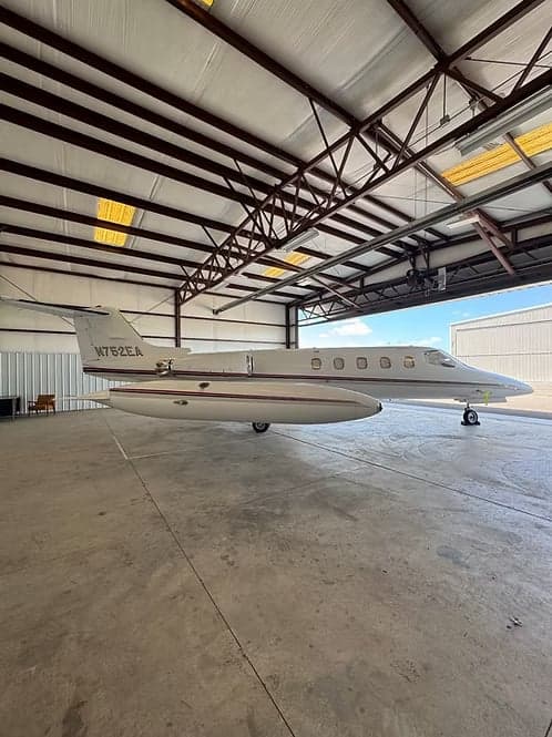 A Learjet 35A with tail number N752EA in a hangar.