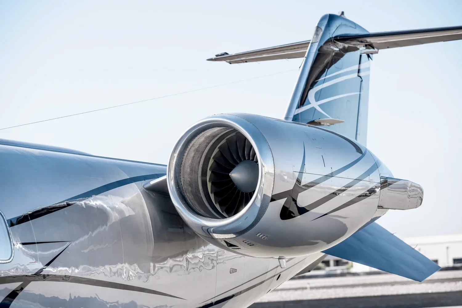 Close-up of the Learjet 45XR, registration N447LA, showing the engine and tail section.