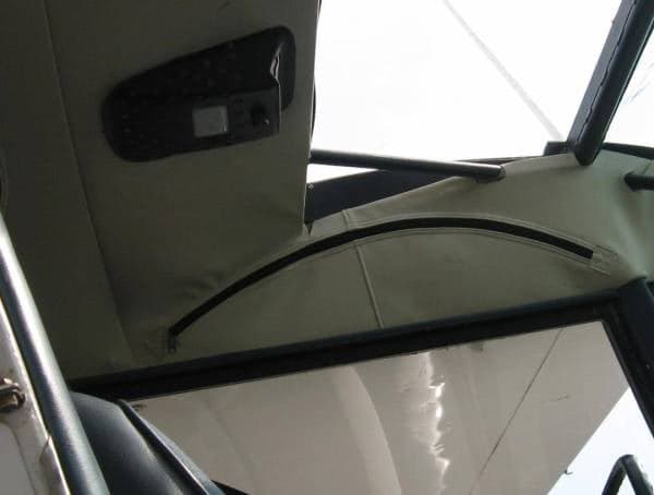 Close-up of the interior ceiling and frame of the aircraft.