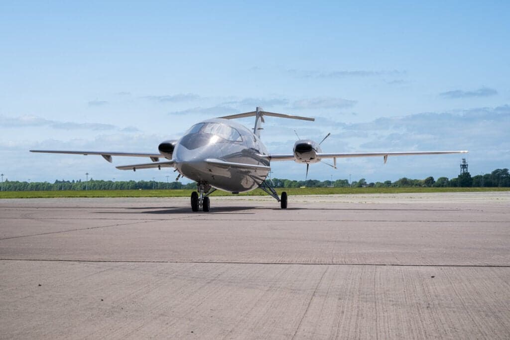 Front view of a Piaggio Avanti EVO aircraft on the tarmac.