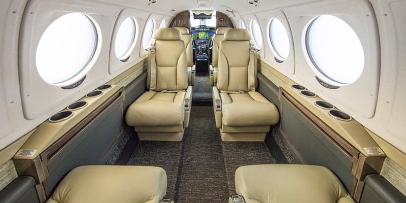 King Air 260 cabin with forward view of the cockpit.