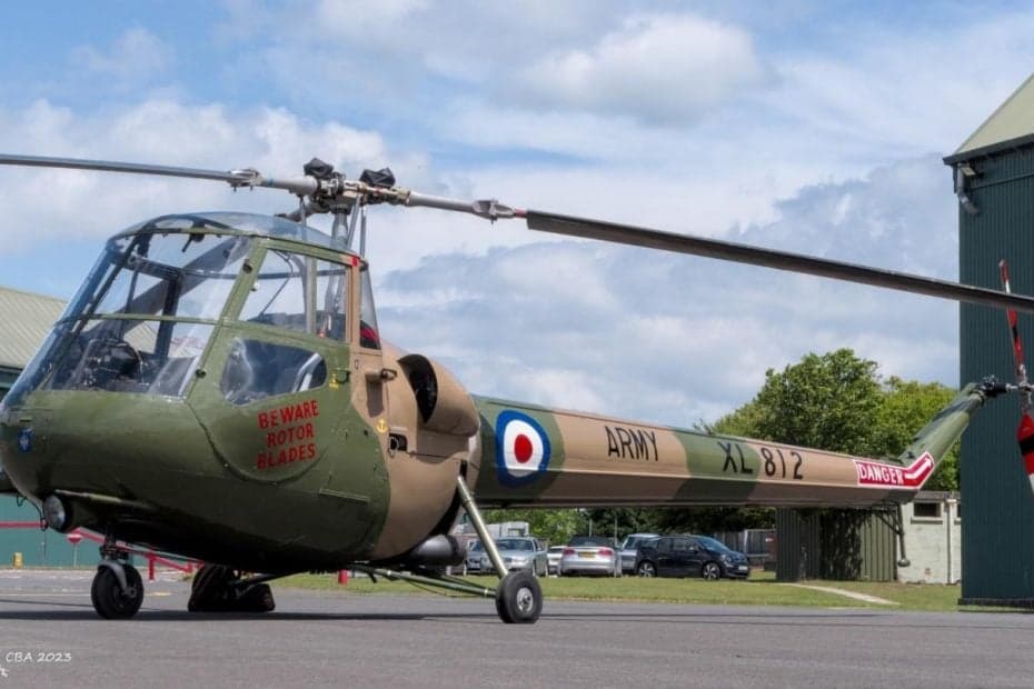 A military helicopter with the word ARMY and registration XL 812 on the side.
