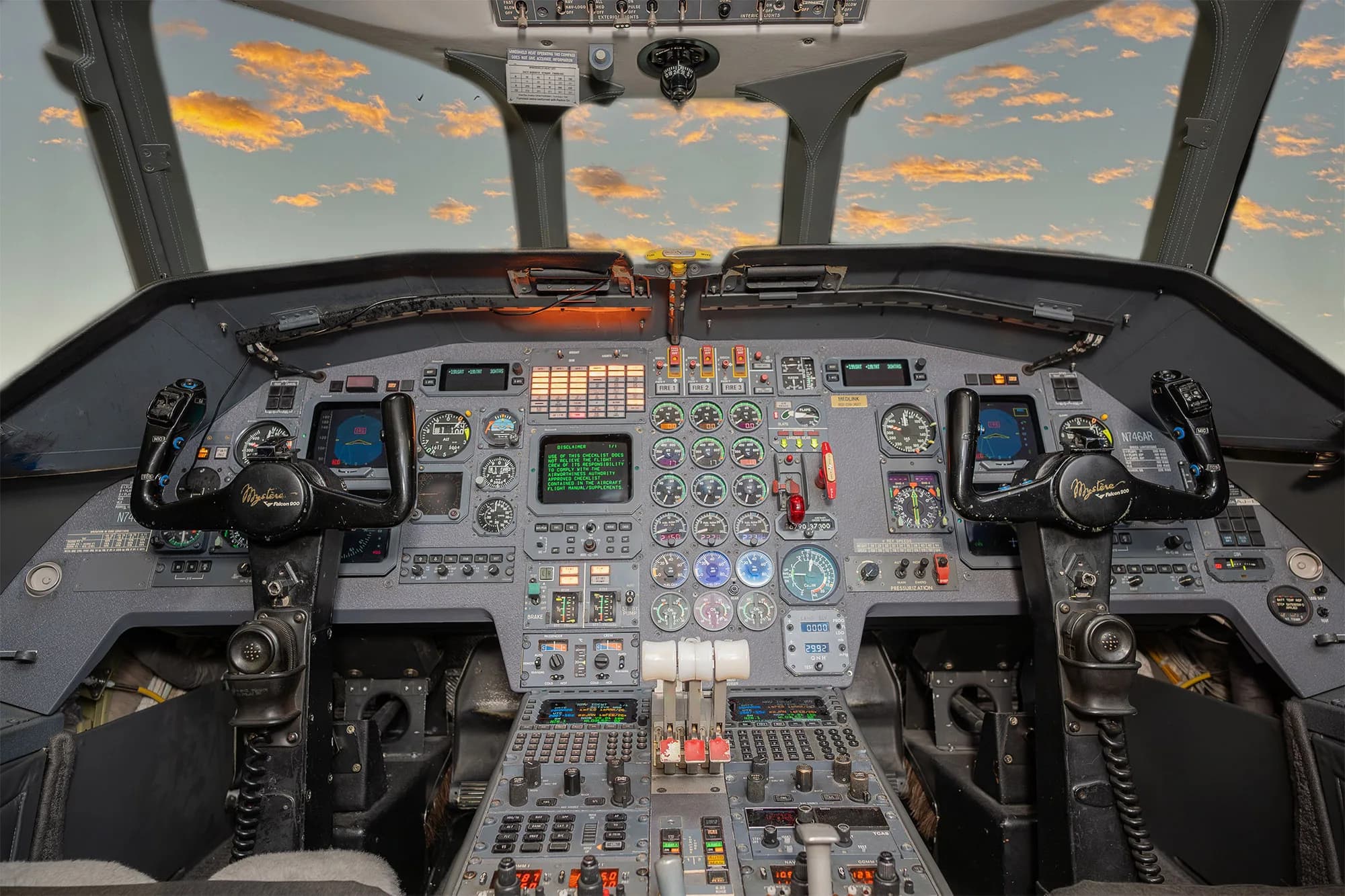 View of the aircraft cockpit with the instrument panel and yokes.