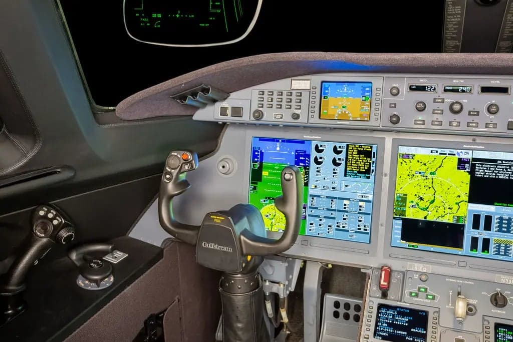 Close-up of the Gulfstream jet's control yoke and display screens.