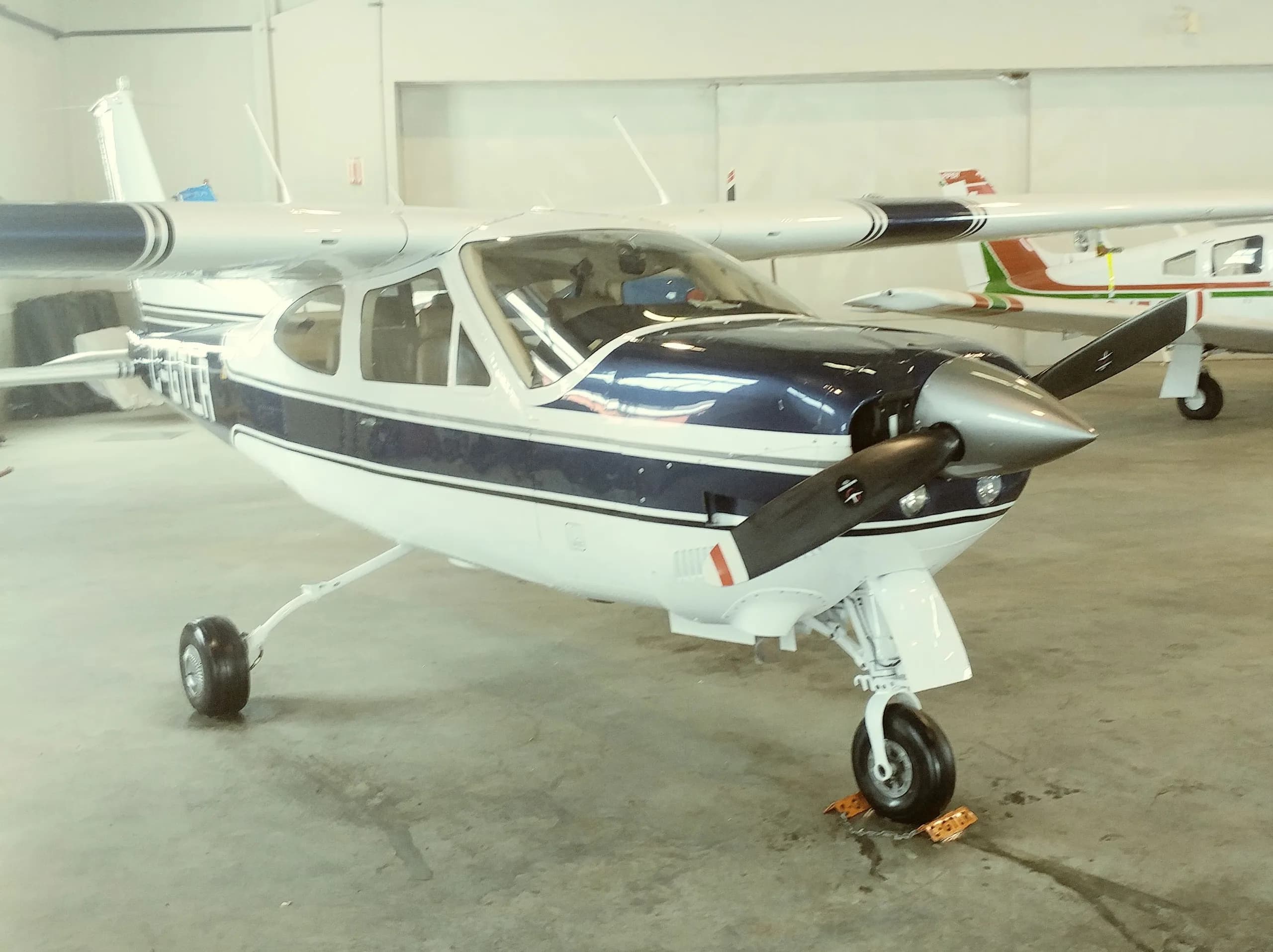 Front quarter view of Cessna C-GTLR parked in a hangar.