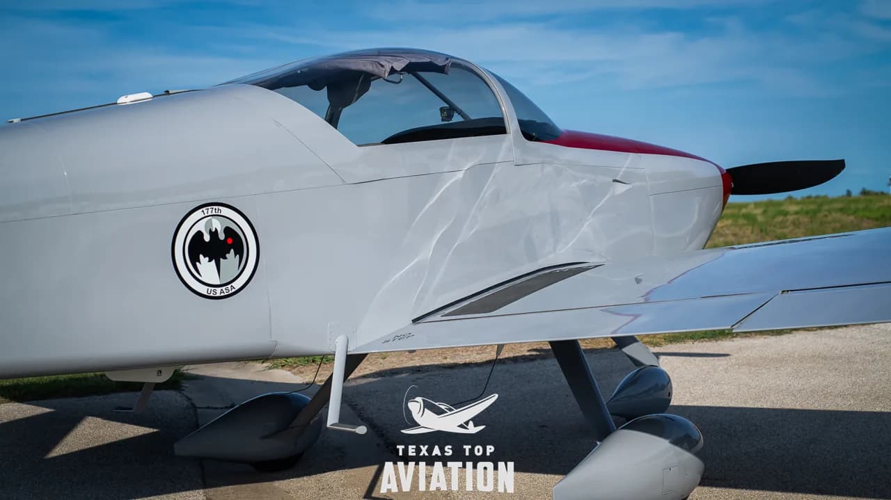 A close-up of the cockpit canopy and mid-fuselage of N1359L, showing a circular '177th US ASA' emblem.