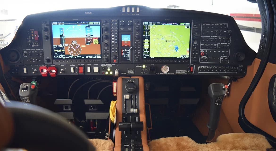 The cockpit of a Diamond DA62 aircraft, featuring a modern glass panel display.