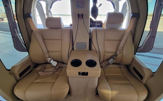 Forward-facing seats in the helicopter cabin.