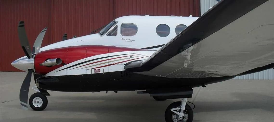 Side view of a Beechcraft King Air on the tarmac.
