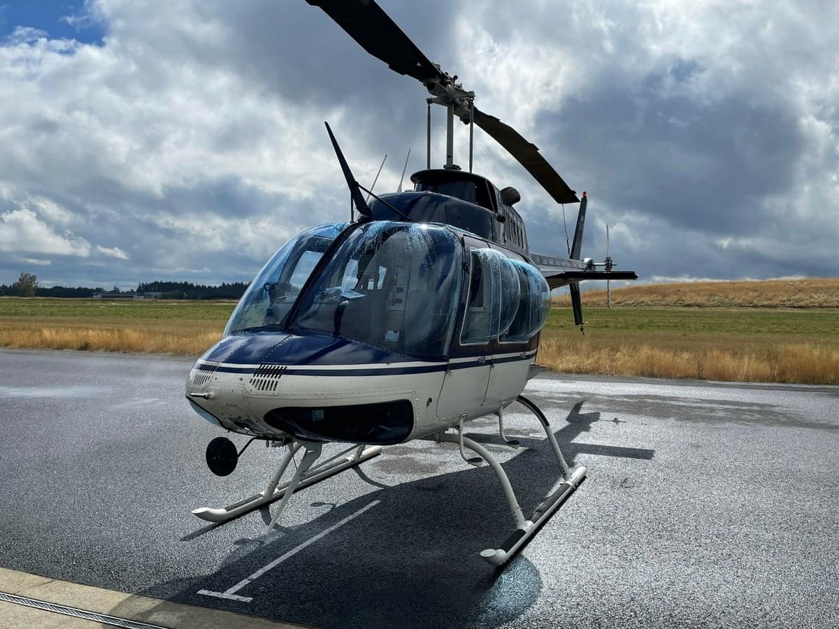 Front view of the N63888 helicopter on the tarmac.
