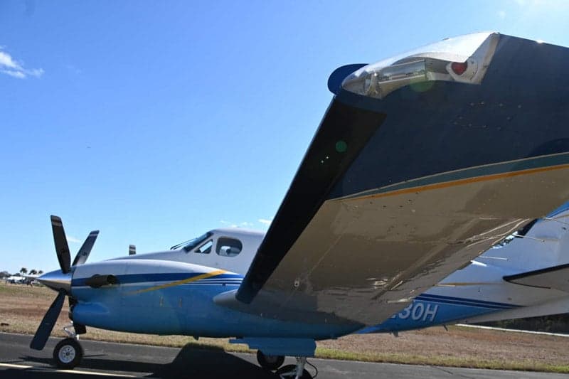 Close up of the wing and engine of a Beechcraft King Air.