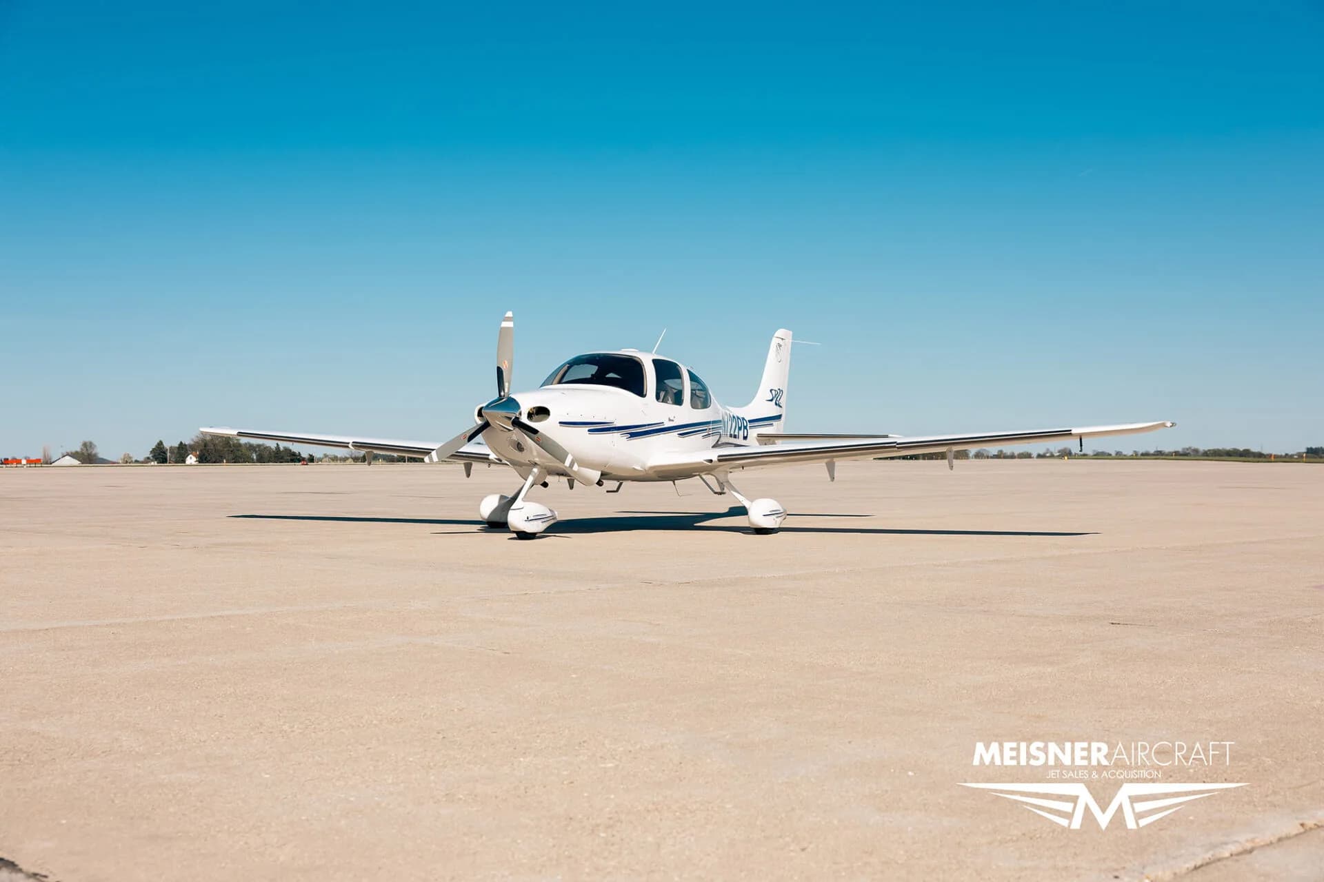 Front view of Cirrus SR22 aircraft, registration N722PB, on the ground.
