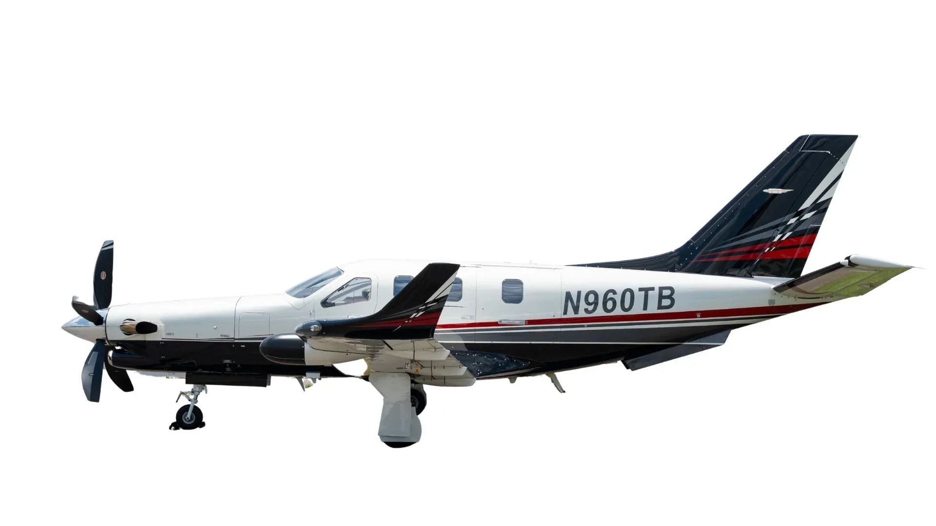 A white, black, and red single-engine turboprop aircraft with registration N960TB, viewed from the side against a white background.