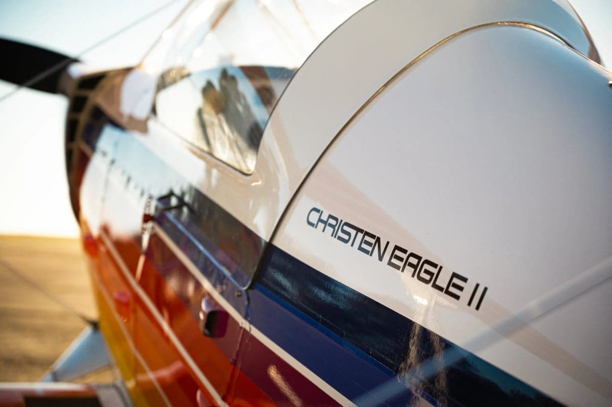 Close-up of the Christen Eagle II logo on the side of the aircraft.