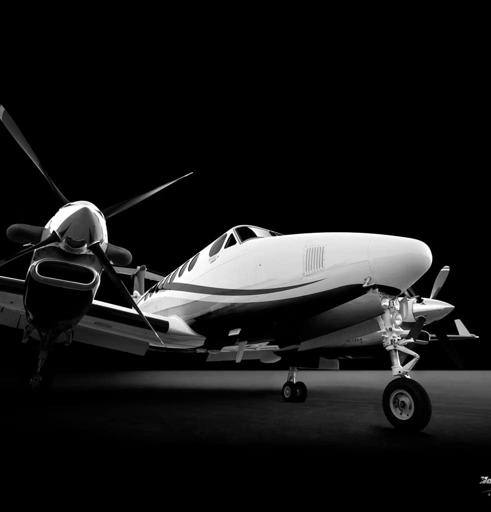 A black and white studio shot of a King Air.