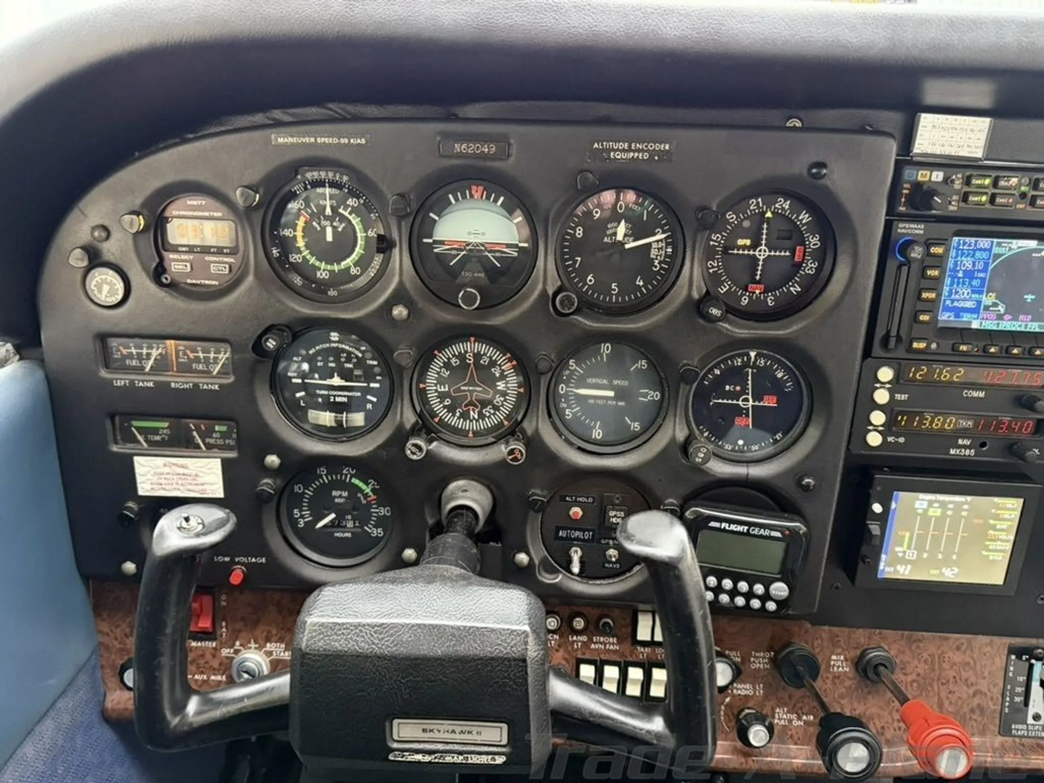 A close-up view of the left side of the cockpit instrument panel, displaying flight instruments and controls.
