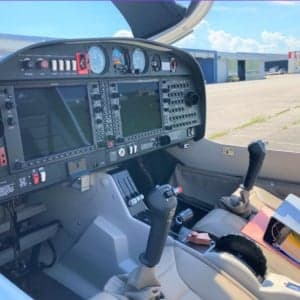 View of the Diamond DA40 cockpit featuring the instrument panel and controls.