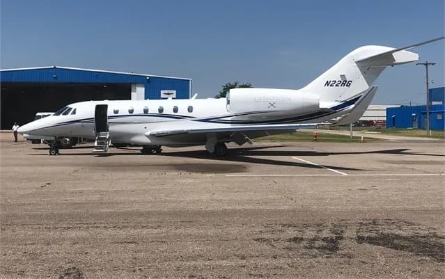 N22RG Citation X aircraft parked on the tarmac with the door open.
