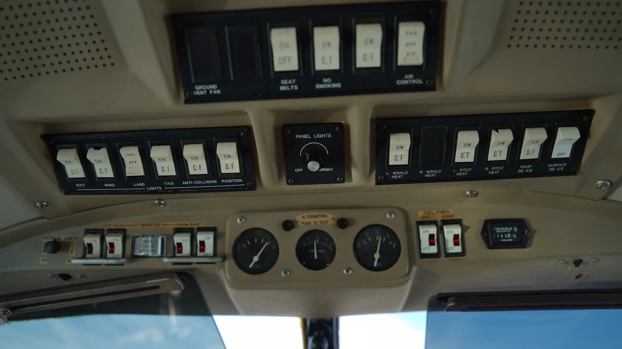Close-up of the aircraft's overhead cockpit switches and gauges.