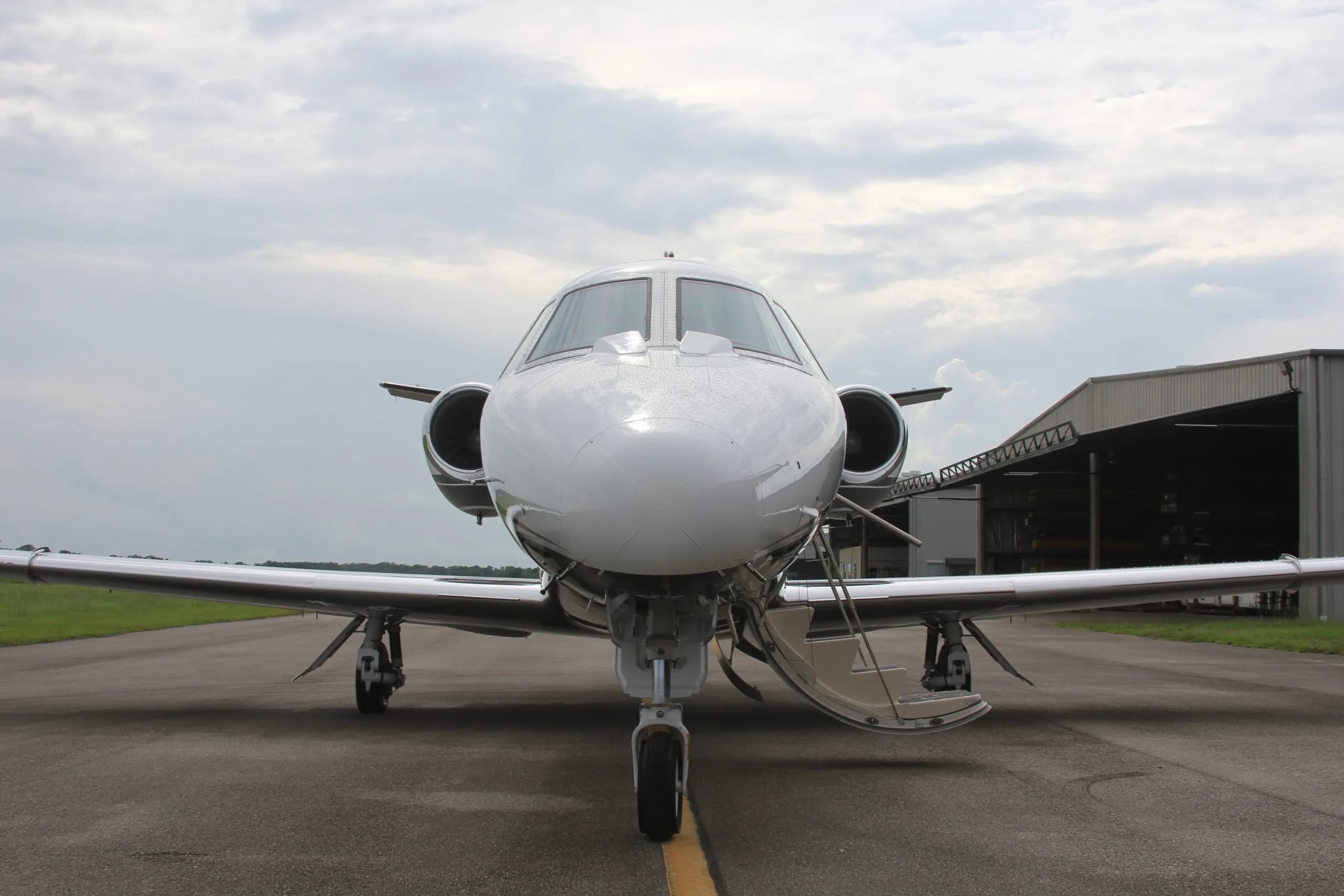 Front view of the N283MM aircraft on the tarmac.