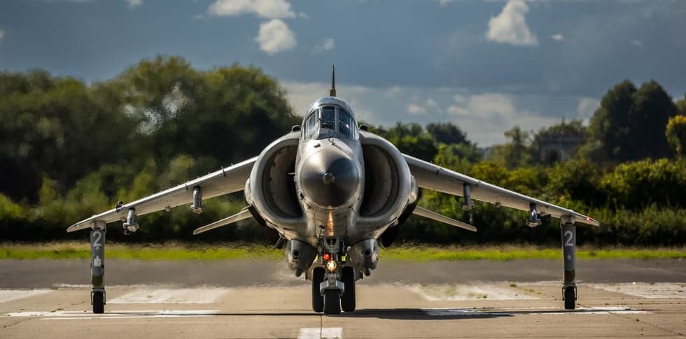 Front view of a Harrier jet on the runway.