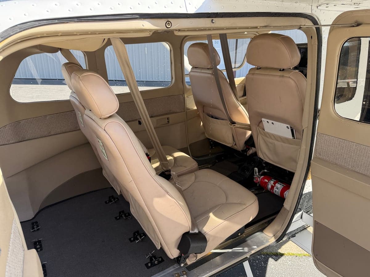 View of the aircraft's rear cabin seats and interior.