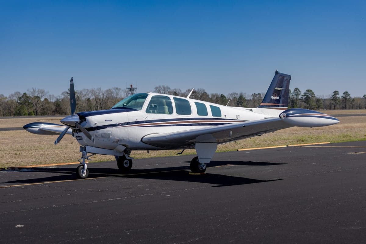 Side view of the Beechcraft Bonanza N219DK on the tarmac.
