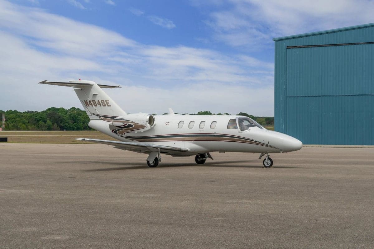 A Cessna Citation CJ1 parked on the tarmac.