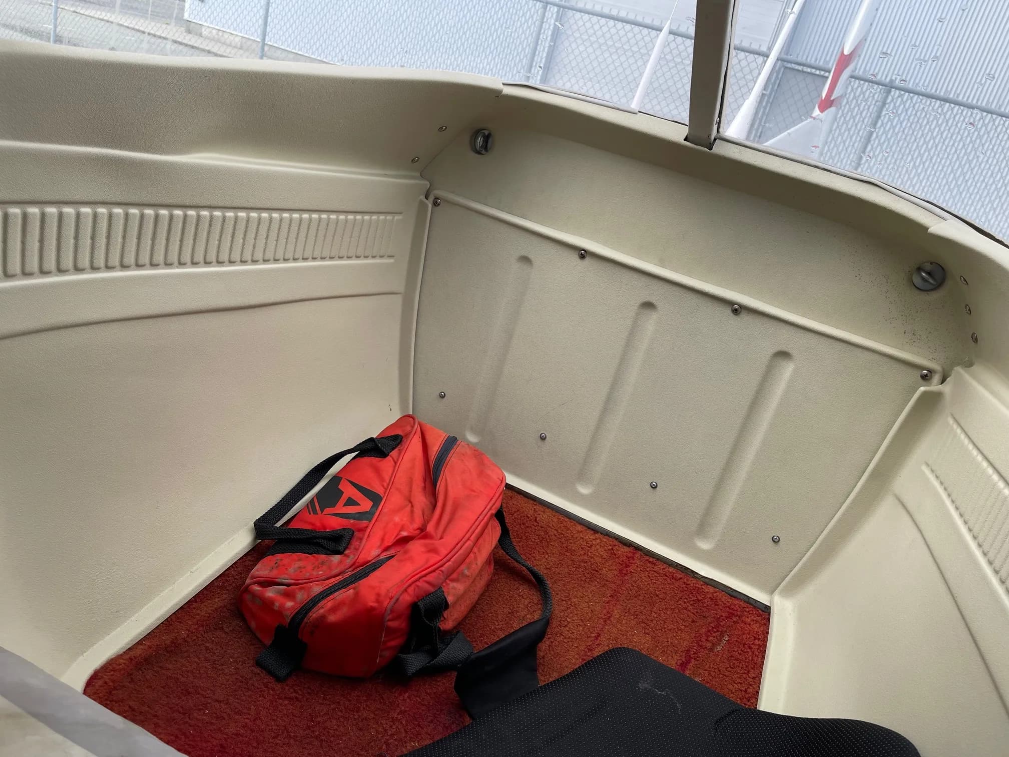 Interior view of the aircraft cabin showing the rear panel and floor.