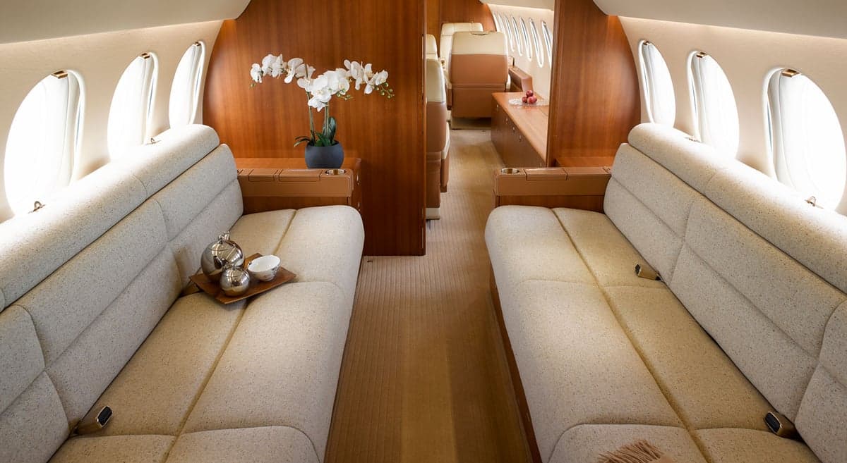 View of the aircraft's interior with seating and a flower arrangement.