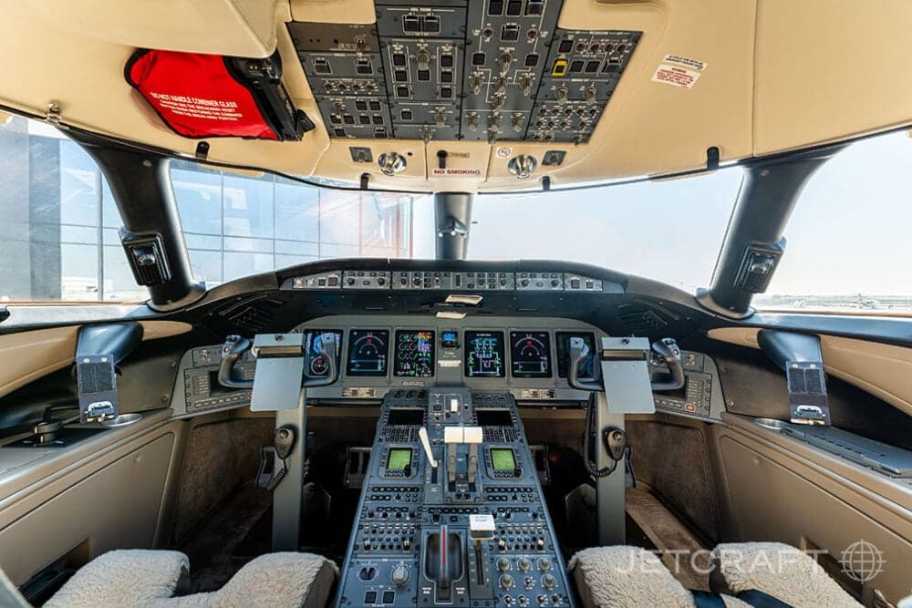 View of the aircraft cockpit with instrument panel and controls.