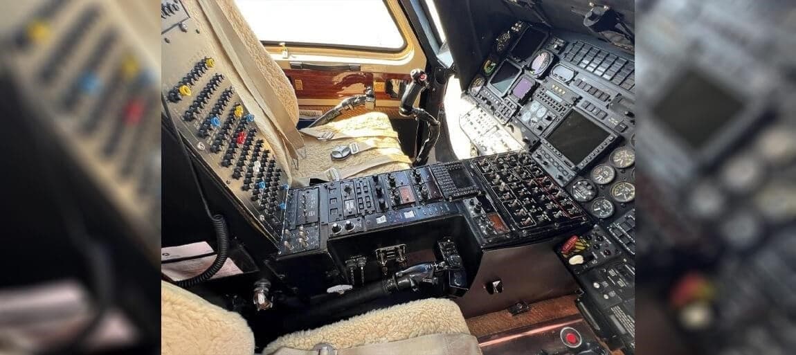 The cockpit of the helicopter features a complex array of instruments and controls.