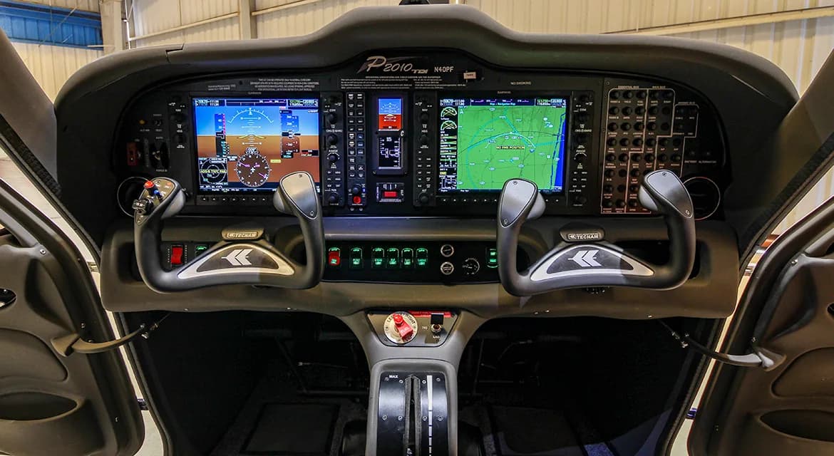 The cockpit of the Techman P2010 TDI aircraft N40PF features a modern glass panel display.