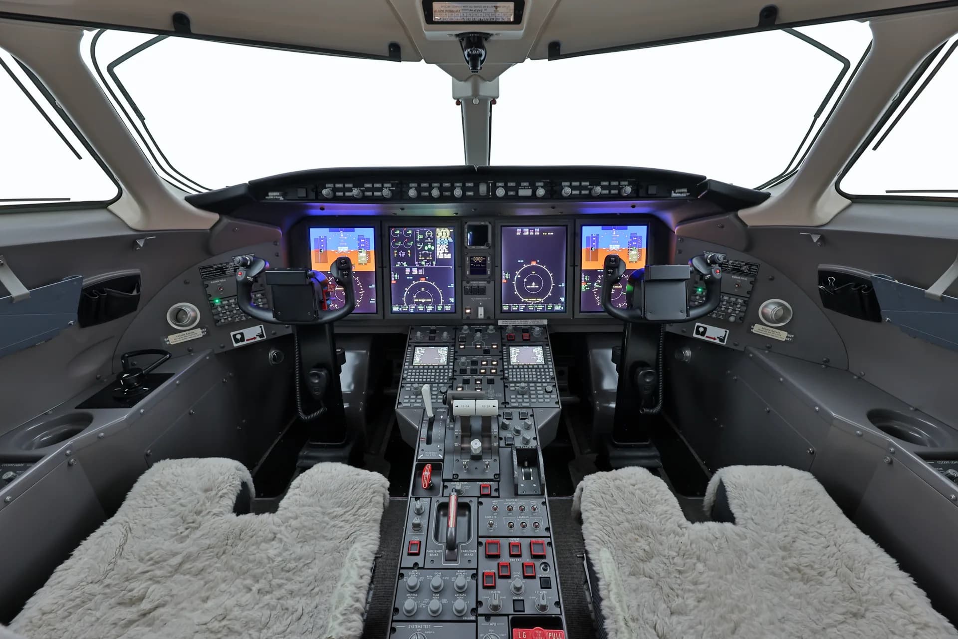 The cockpit of a Challenger aircraft with full instrumentation.