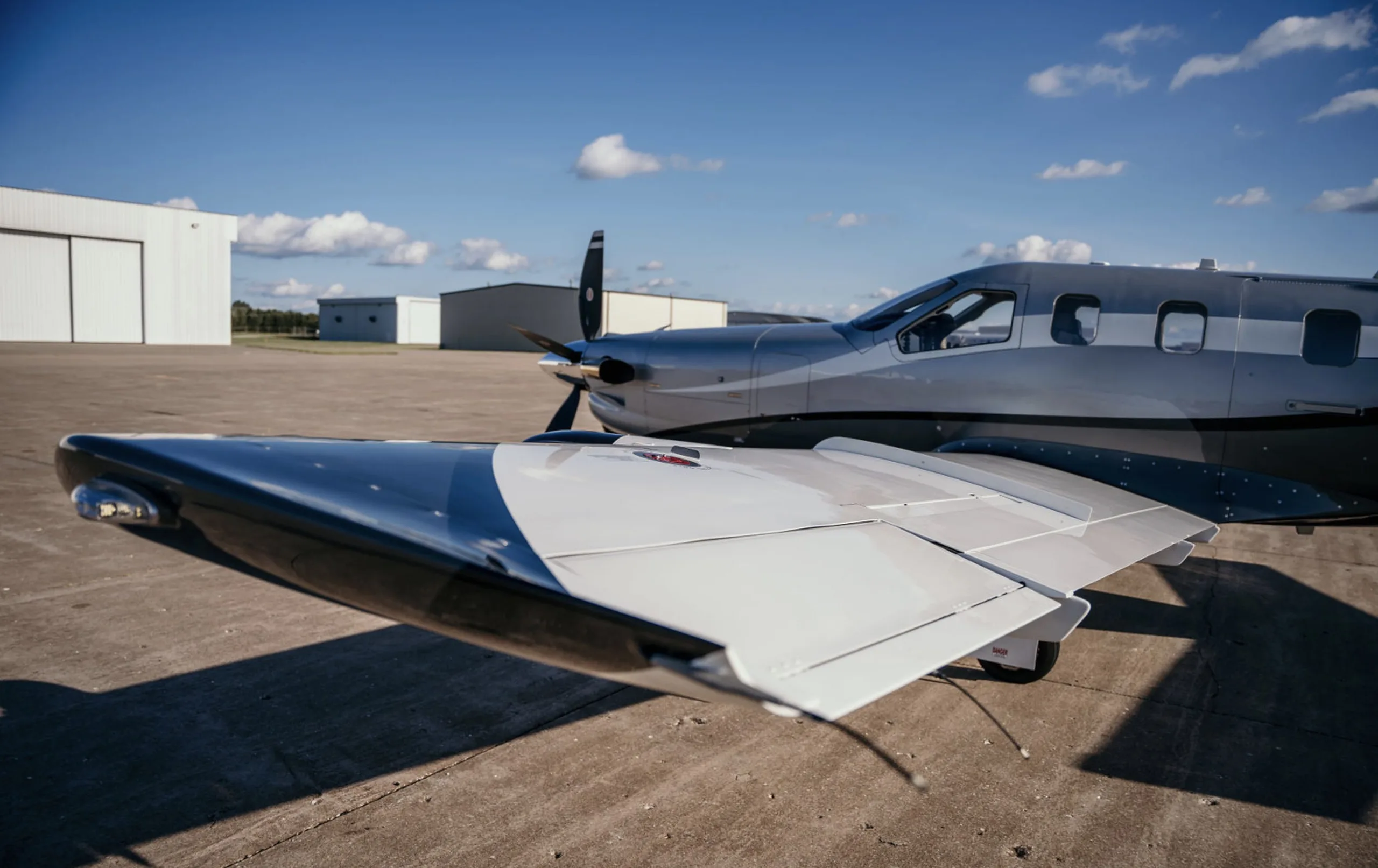 Close-up of the wing of the N850VF aircraft on the tarmac.