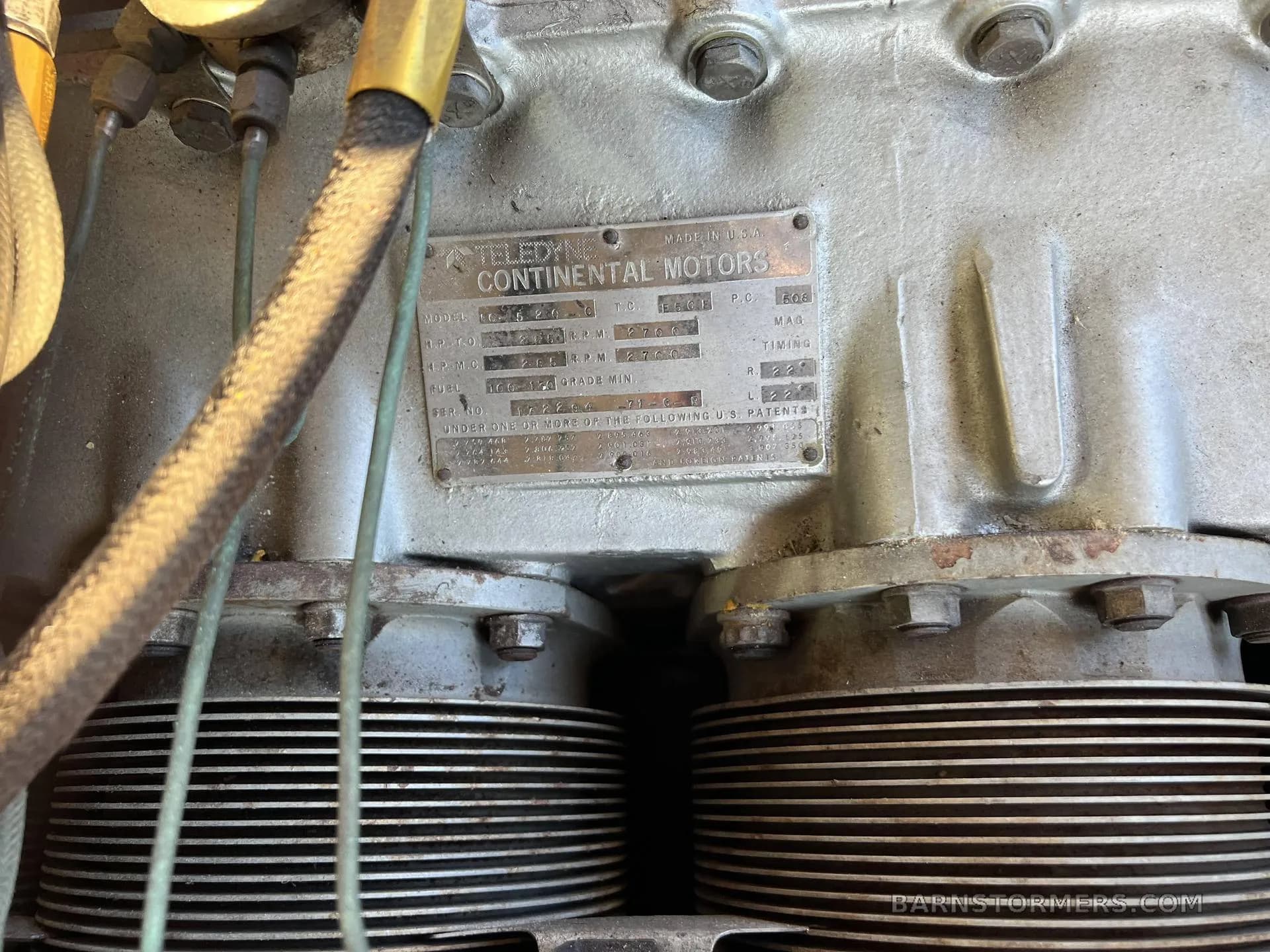 A close-up of the Teledyne Continental Motors data plate on an aircraft engine.