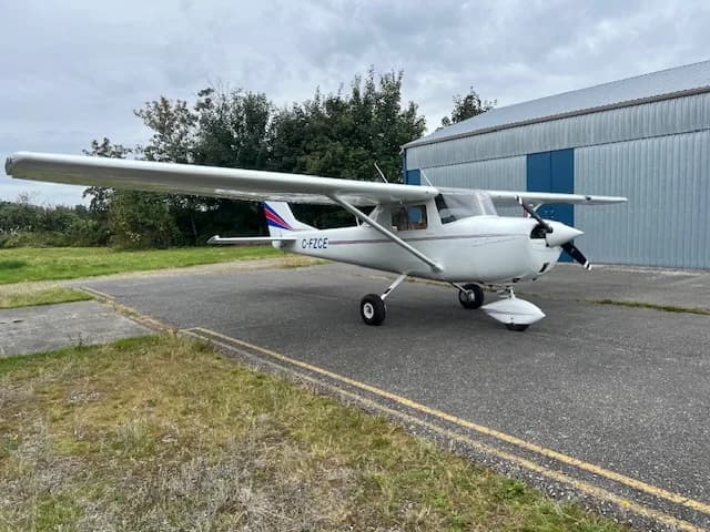 C-FZCE Cessna aircraft parked on the tarmac in front of a hangar.